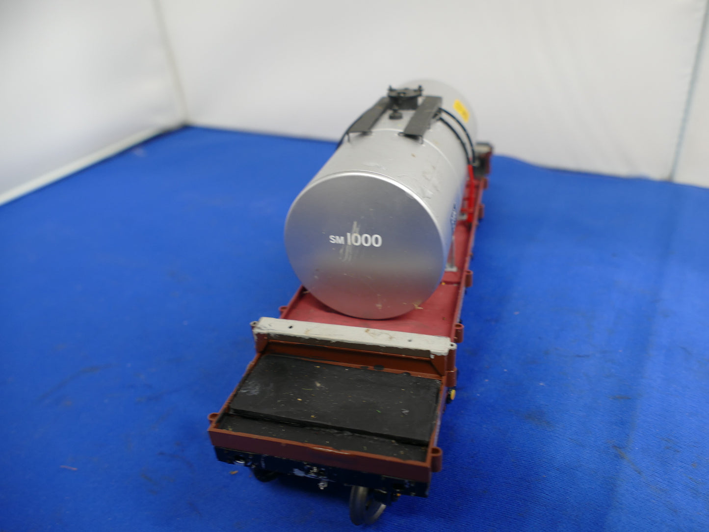 "O" Gauge Silver Tanker on Bogie Flatbed (used)