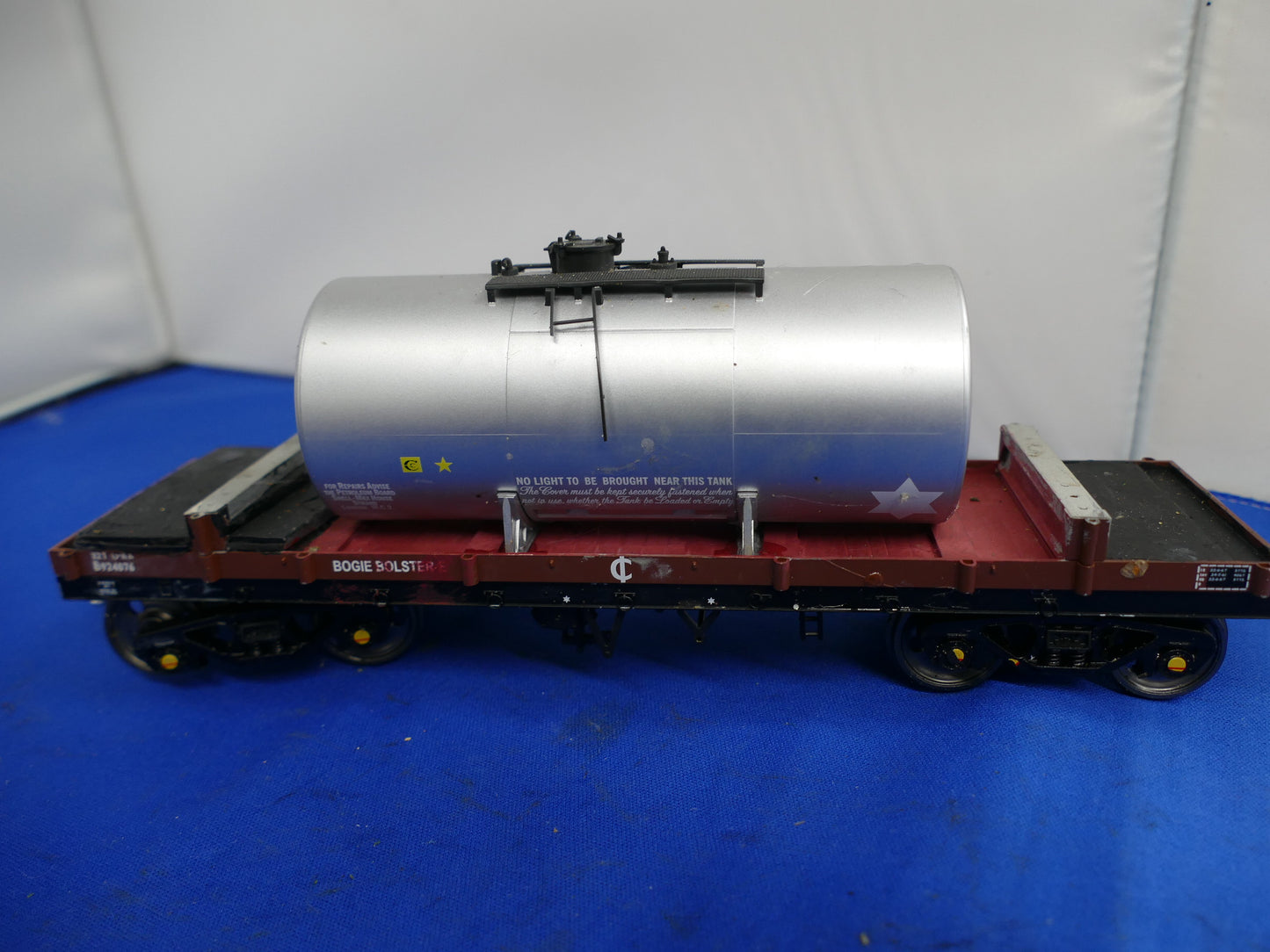 "O" Gauge Silver Tanker on Bogie Flatbed (used)