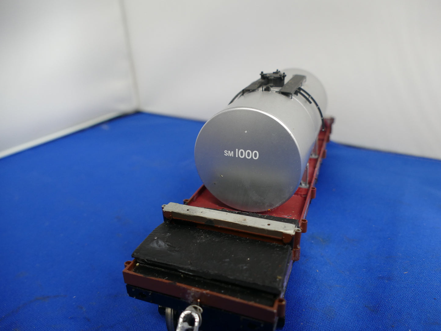 "O" Gauge Silver Tanker on Bogie Flatbed (used)